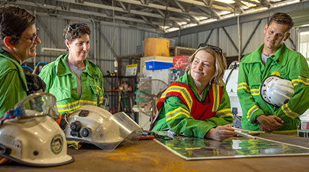 An image of Public sector employees looking at a map